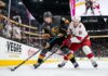 How to Watch Carolina Hurricanes vs Vegas Golden Knights Game 4 | TV & Prediction Stanley Cup Final Game 4 action: Mitch Marner (grey jersey, #16) of the Vegas Golden Knights and Jackson Blake (white jersey, #51) of the Carolina Hurricanes battle on the ice at T-Mobile Arena.