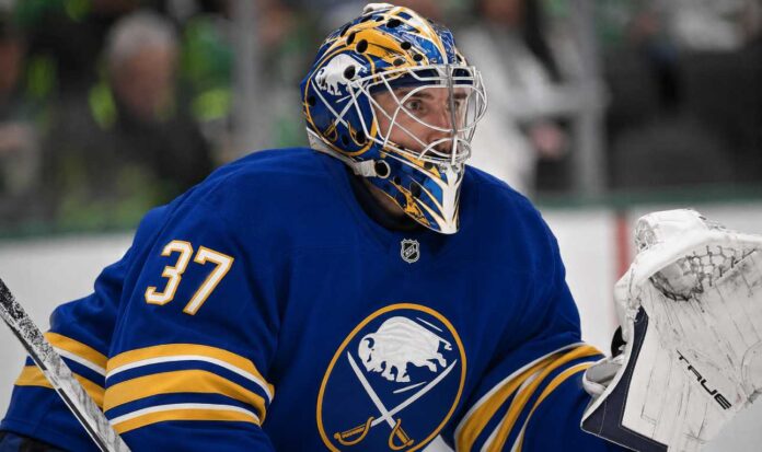 Connor Hellebuyck wearing a Buffalo Sabres jersey and goalie mask amid NHL trade rumours involving the Winnipeg Jet