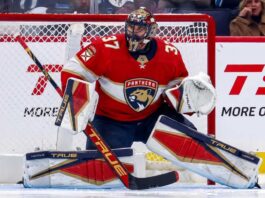 Connor Hellebuyck Trade Rumors: Could the Jets Star Join the Florida Panthers? Winnipeg Jets goaltender Connor Hellebuyck in his butterfly stance during an NHL game, wearing his signature blue and white goalie gear. The image captures him focused on the action in front of the net.