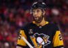 Medium shot of NHL defenseman Darnell Nurse visualized in a Pittsburgh Penguins black and gold home jersey amidst trade rumors linking him away from the Edmonton Oilers.