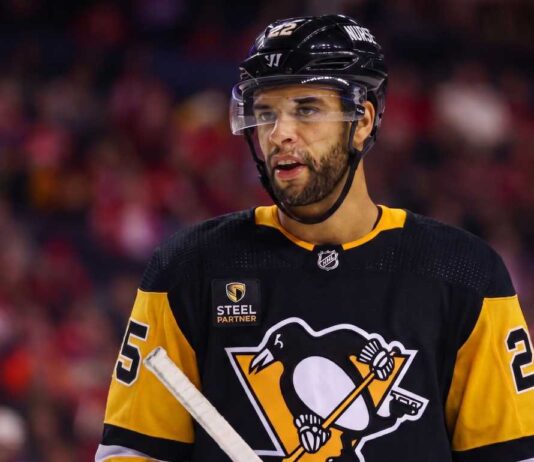 Darnell Nurse Trade Rumors: Oilers Defenseman Linked to Penguins Medium shot of NHL defenseman Darnell Nurse visualized in a Pittsburgh Penguins black and gold home jersey amidst trade rumors linking him away from the Edmonton Oilers.