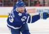 Toronto Maple Leafs Acquire Darren Raddysh in Blockbuster Sign-and-Trade Toronto Maple Leafs defenseman Darren Raddysh windup up for a shot on goal.