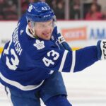 Toronto Maple Leafs Acquire Darren Raddysh in Blockbuster Sign-and-Trade Toronto Maple Leafs defenseman Darren Raddysh windup up for a shot on goal.