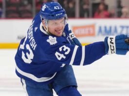 Toronto Maple Leafs Acquire Darren Raddysh in Blockbuster Sign-and-Trade Toronto Maple Leafs defenseman Darren Raddysh windup up for a shot on goal.