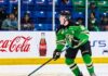 Daxon Rudolph: Why the Florida Panthers Should Draft Him #9 in 2026 Daxon Rudolph, 2026 NHL Draft prospect, skating with the puck in a Prince Albert Raiders green jersey (number 10) during a WHL game, showcasing junior hockey stats for Florida Panthers scouts.