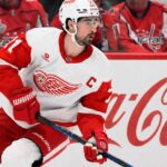 Dylan Larkin Detroit Red Wings captain skating past Coca-Cola boards as NHL trade rumors continue around Steve Yzerman’s offseason plans