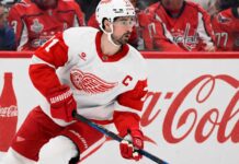 Dylan Larkin Detroit Red Wings captain skating past Coca-Cola boards as NHL trade rumors continue around Steve Yzerman’s offseason plans