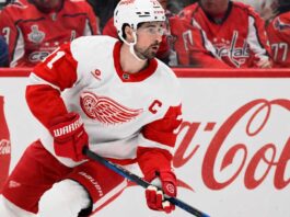 Dylan Larkin Detroit Red Wings captain skating past Coca-Cola boards as NHL trade rumors continue around Steve Yzerman’s offseason plans