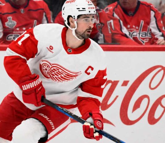 Dylan Larkin Detroit Red Wings captain skating past Coca-Cola boards as NHL trade rumors continue around Steve Yzerman’s offseason plans