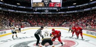 How to Watch Vegas Golden Knights vs Carolina Hurricanes Game 2 Vegas Golden Knights and Carolina Hurricanes center ice faceoff during Period 1 of the 2026 Stanley Cup Final Game 2, showing a packed arena and scoreboard.