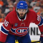Kirill Marchenko wearing a Montreal Canadiens home jersey amid trade rumors linking the Columbus Blue Jackets winger to the Habs