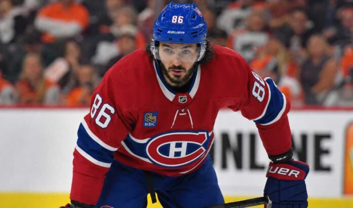 Kirill Marchenko wearing a Montreal Canadiens home jersey amid trade rumors linking the Columbus Blue Jackets winger to the Habs