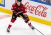 Maddox Dagenais #16 of the Quebec Remparts QMJHL, a 6'4" center, skating with the puck. Background rink boards with large Coca-Cola logo. Image from an article on Utah Mammoth NHL Draft pick analysis.