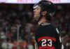Ottawa Senators Trade Rumors: Anaheim Ducks’ Mason McTavish Linked to Sens A close-up profile view of NHL hockey player Mason McTavish #23 wearing a black Ottawa Senators jersey and helmet, looking focused on the ice.