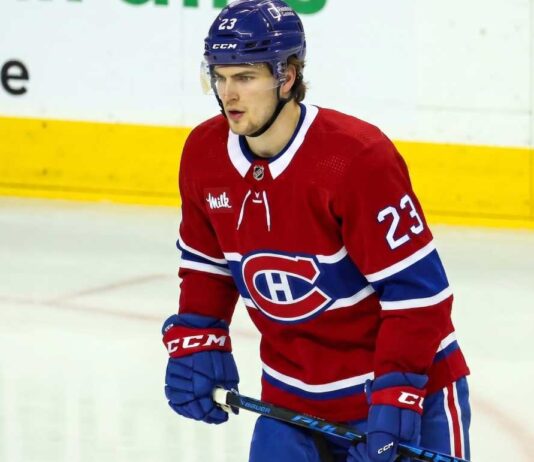 An imagined photo of hockey player Matthew Knies in a Montreal Canadiens home jersey on the ice.