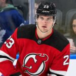 New Jersey Devils Trade Rumors: Could They Land Matthew Knies? A close-up photo of hockey player Matthew Knies wearing a red New Jersey Devils home jersey, number 23, illustrative of the blockbuster trade rumor discussed in the article regarding a potential move from the Toronto Maple Leafs.