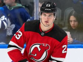 New Jersey Devils Trade Rumors: Could They Land Matthew Knies? A close-up photo of hockey player Matthew Knies wearing a red New Jersey Devils home jersey, number 23, illustrative of the blockbuster trade rumor discussed in the article regarding a potential move from the Toronto Maple Leafs.