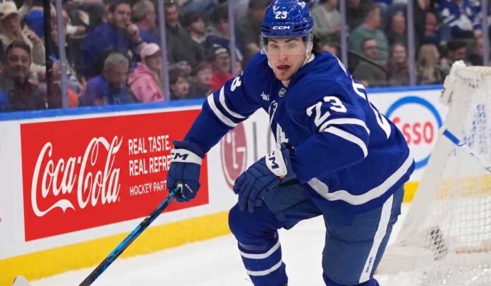 matthew-knies-toronto-maple-leafs-trade-rumors Matthew Knies #23 of the Toronto Maple Leafs skating during an NHL game, surrounded by NHL trade rumors.
