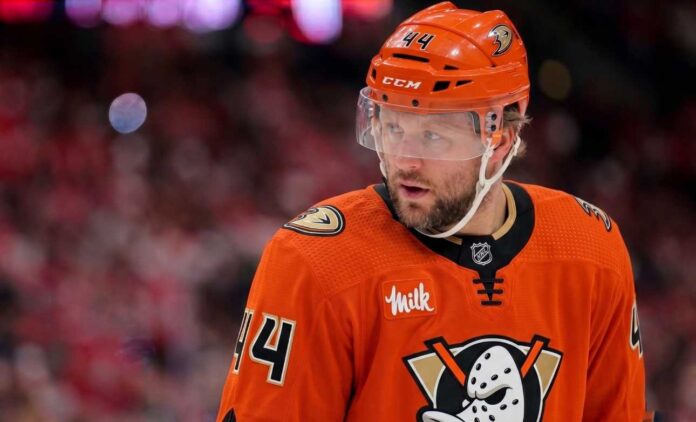 Close-up photo of Toronto Maple Leafs defenseman Morgan Rielly (#44) visualized in an Anaheim Ducks uniform looking thoughtfully during an NHL hockey game.
