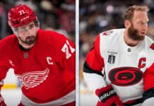NHL News & Rumors Today: Carolina Hurricanes Take 3-2 Series Lead, latest Larkin rumors A split-screen composite photograph for an NHL news blog. The left panel features Detroit Red Wings captain Dylan Larkin (#71) in a red home jersey, holding his stick with an intense gaze, highlighting current NHL trade rumors. The right panel shows Carolina Hurricanes captain Jordan Staal in a white away jersey, with the Stanley Cup patch and 'C', looking over his shoulder during a game, representing his team's push in the Stanley Cup Final.