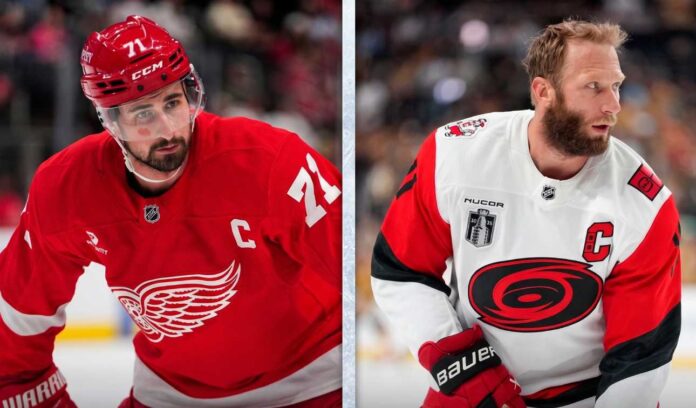 nhl-news-scores-rumors-june-12-2026 A split-screen composite photograph for an NHL news blog. The left panel features Detroit Red Wings captain Dylan Larkin (#71) in a red home jersey, holding his stick with an intense gaze, highlighting current NHL trade rumors. The right panel shows Carolina Hurricanes captain Jordan Staal in a white away jersey, with the Stanley Cup patch and 'C', looking over his shoulder during a game, representing his team's push in the Stanley Cup Final.
