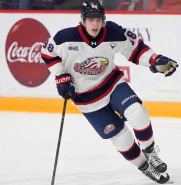 Saginaw Spirit forward Nikita Klepov (99) skates with the puck, showcasing the elite offensive drive and competitive edge that makes him a prime target for the Columbus Blue Jackets at #14 in the 2026 NHL Draft.