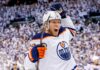 Patrik Laine Free Agency: 4 Teams Linked to Pending NHL UFA Conceptual action photo of NHL player Patrik Laine celebrating wildly in an Edmonton Oilers white away jersey and helmet, illustrating potential Free Agency landing spots for the pending UFA.