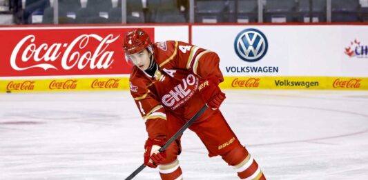 Vancouver Giants defenseman Ryan Lin, a top target for the New Jersey Devils in the 2026 NHL Draft, stickhandling on the ice during transition play.