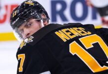 A conceptual image visualizing New Jersey Devils defenseman Simon Nemec wearing a black Pittsburgh Penguins home jersey and helmet, illustrating current NHL trade rumors.