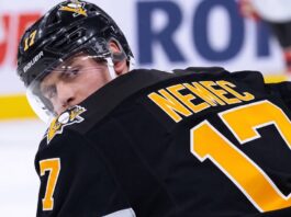 A conceptual image visualizing New Jersey Devils defenseman Simon Nemec wearing a black Pittsburgh Penguins home jersey and helmet, illustrating current NHL trade rumors.