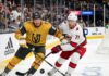How to Watch Vegas Golden Knights vs. Carolina Hurricanes Game 1 Action shot of Vegas Golden Knights forward Jack Eichel and a Carolina Hurricanes opponent battling for the puck on the ice during Game 1 of the 2026 Stanley Cup Final, with cheering fans, NHL logos, and the 'Vegas Golden Knights' rink board in the background.