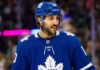 Toronto Maple Leafs Trade Rumors: Vincent Trocheck & NY Rangers An action shot of Vincent Trocheck wearing a blue Toronto Maple Leafs jersey and helmet, skating on the ice at Scotiabank Arena in this conceptual trade rumor image.