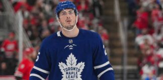 Toronto Maple Leafs Trade Rumors: Could the Leafs Acquire Zach Werenski from the Columbus Blue Jackets? Zach Werenski wearing a Toronto Maple Leafs home jersey in NHL trade rumor image linking the Columbus Blue Jackets defenseman to Toronto