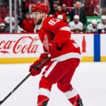 Detroit Red Wings Alex DeBrincat Trade Rumors: Will Detroit Trade Him? Alex DeBrincat skating for the Detroit Red Wings as trade rumors raise questions about his future in Detroit