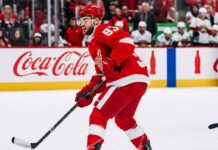 Detroit Red Wings Alex DeBrincat Trade Rumors: Will Detroit Trade Him? Alex DeBrincat skating for the Detroit Red Wings as trade rumors raise questions about his future in Detroit