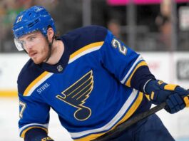 St. Louis Blues Emerge as Serious Alexander Nikishin Trade Candidate Alexander Nikishin pictured in a St. Louis Blues home jersey amid trade rumors linking the Carolina Hurricanes defenseman to St. Louis.