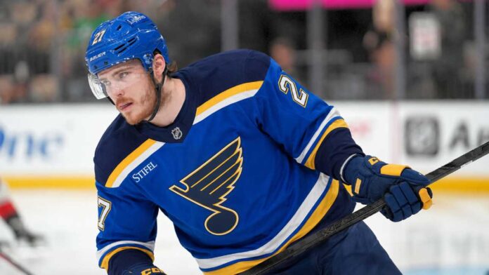 alexander-nikishin-st-louis-blues-trade-rumors Alexander Nikishin pictured in a St. Louis Blues home jersey amid trade rumors linking the Carolina Hurricanes defenseman to St. Louis.