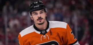Arber Xhekaj wearing a Philadelphia Flyers home jersey amid NHL trade rumors involving the Montreal Canadiens.