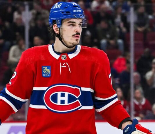 Montreal Canadiens defenceman in a red home jersey during an NHL game as Arber Xhekaj trade rumors continue