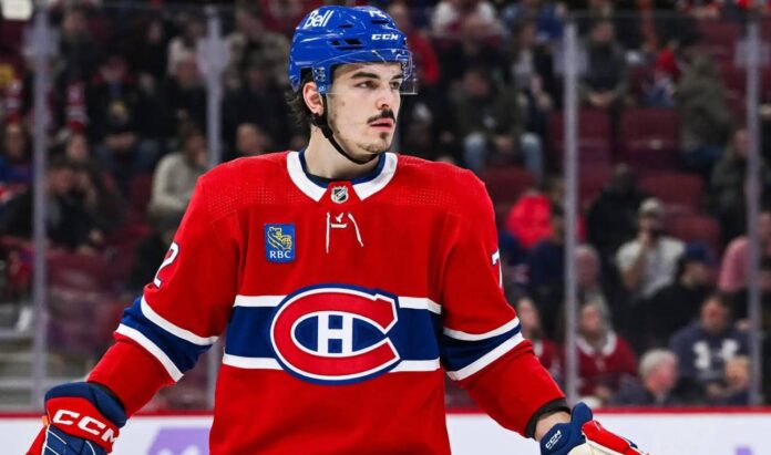 Montreal Canadiens defenceman in a red home jersey during an NHL game as Arber Xhekaj trade rumors continue
