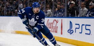 Auston Matthews skating in a Toronto Maple Leafs home jersey with the captain’s C during the 2026-27 NHL season.