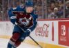Cale Makar skating for the Colorado Avalanche as a right-shot defenseman beside Coca-Cola and Nintendo Switch board ads during a 2026-27 Fantasy Hockey projection.