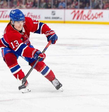 Cole Caufield Fantasy Hockey Projection: Goals, Assists and Points for 2026-27 Cole Caufield skating in a Montreal Canadiens home jersey beside Coca-Cola and PS5 board ads for a 2026-27 Fantasy Hockey projection.
