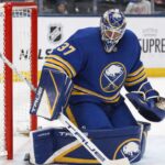 Connor Hellebuyck Open to Buffalo Sabres Trade as Winnipeg Jets Talks Continue Connor Hellebuyck wearing a Buffalo Sabres home uniform and matching goalie equipment amid trade rumors involving the Winnipeg Jets.