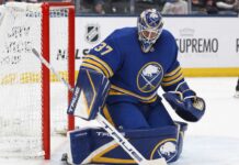 Connor Hellebuyck Open to Buffalo Sabres Trade as Winnipeg Jets Talks Continue Connor Hellebuyck wearing a Buffalo Sabres home uniform and matching goalie equipment amid trade rumors involving the Winnipeg Jets.