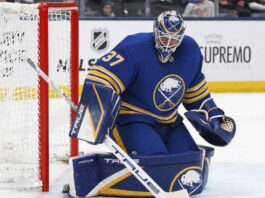 Connor Hellebuyck Open to Buffalo Sabres Trade as Winnipeg Jets Talks Continue Connor Hellebuyck wearing a Buffalo Sabres home uniform and matching goalie equipment amid trade rumors involving the Winnipeg Jets.