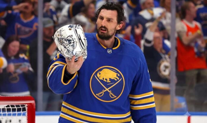 connor-hellebuyck-buffalo-sabres-trade-rumors Connor Hellebuyck in a Buffalo Sabres jersey amid Sabres trade rumors.