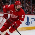 Will Dylan Larkin Stay With the Detroit Red Wings After Steve Yzerman’s Exit? Detroit Red Wings captain Dylan Larkin skating along the boards as trade speculation continues following Steve Yzerman’s departure.