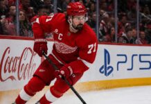 Will Dylan Larkin Stay With the Detroit Red Wings After Steve Yzerman’s Exit? Detroit Red Wings captain Dylan Larkin skating along the boards as trade speculation continues following Steve Yzerman’s departure.