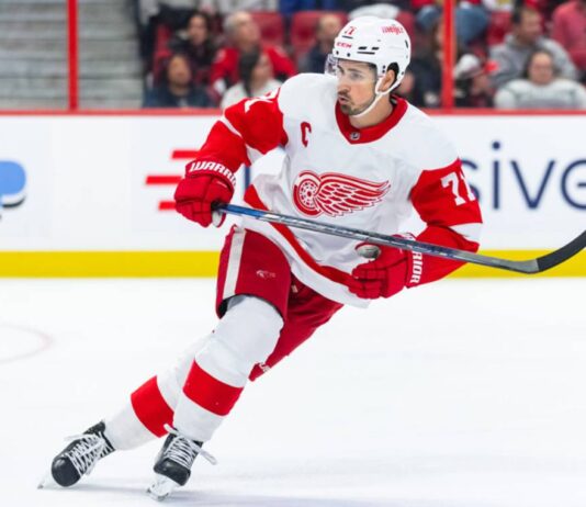 Dylan Larkin skating in a Detroit Red Wings away jersey amid NHL trade rumors linking the Red Wings captain to Philadelphia